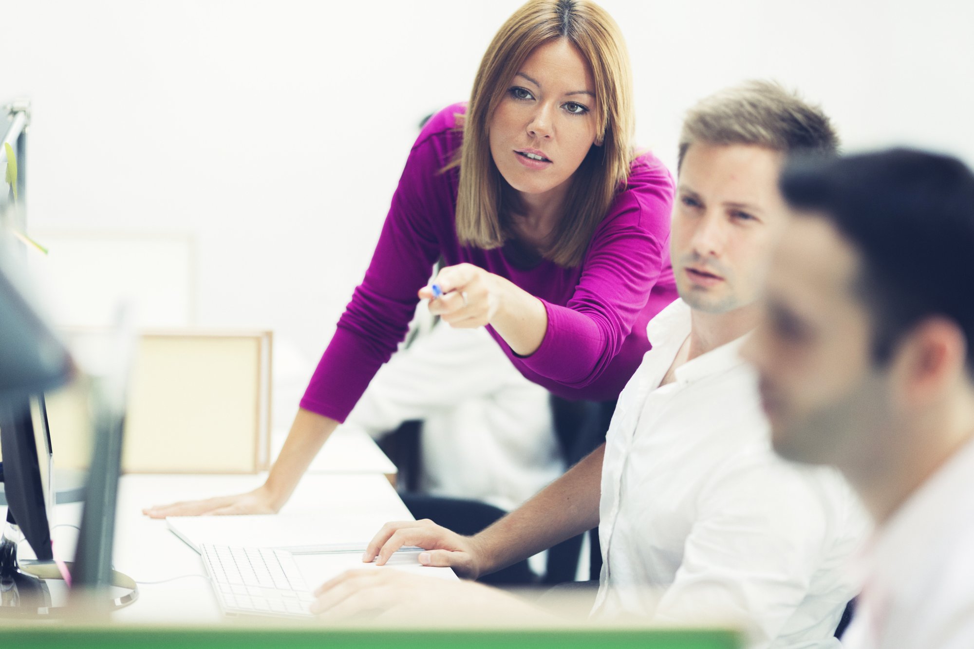 GettyImages-524908113-Woman_Pointing_at_Computer-RET