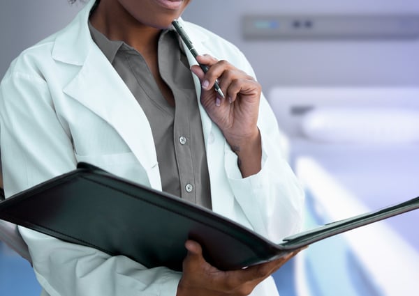 A pensive doctor with a folder