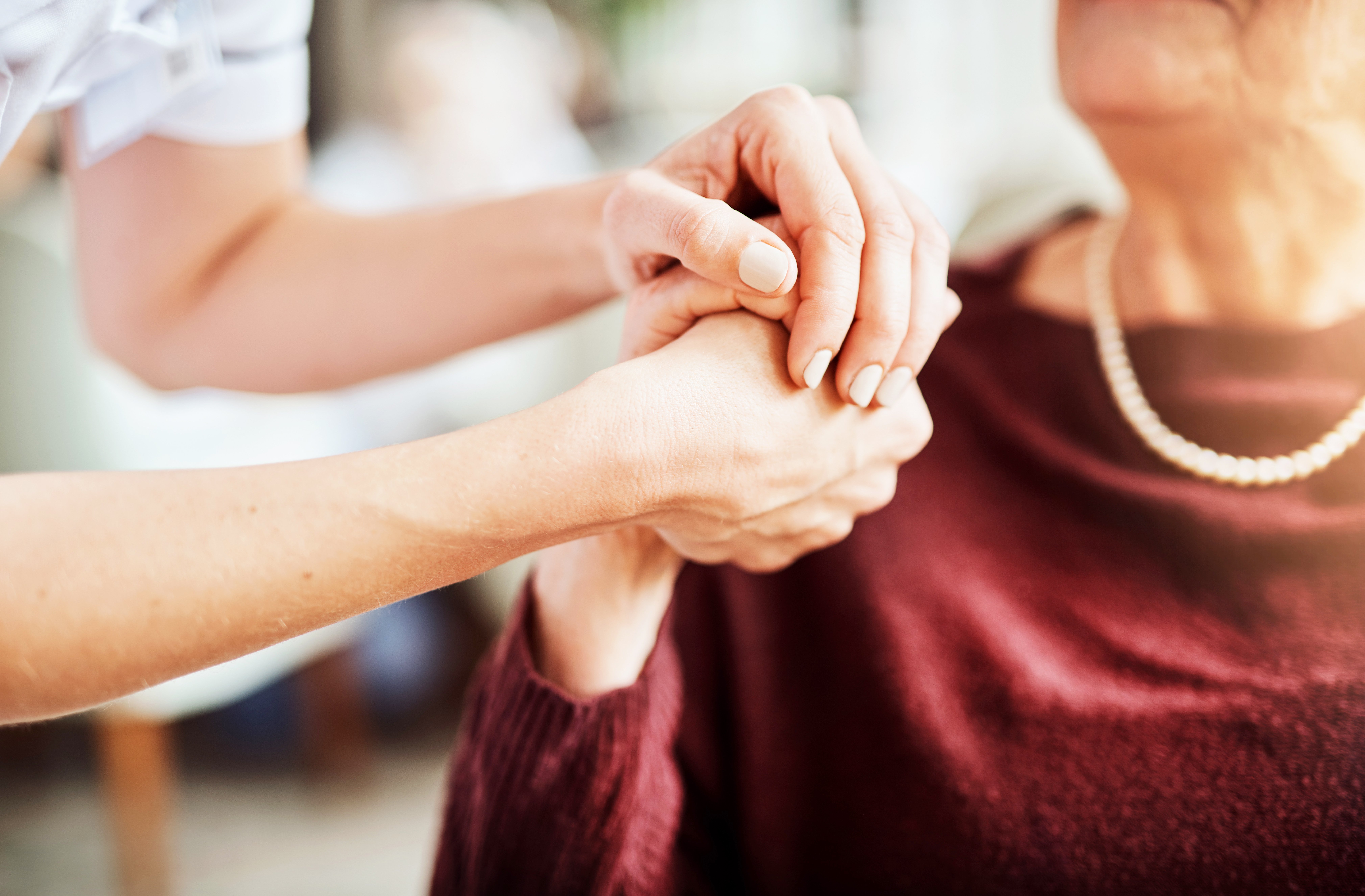 GettyImages-1076488990-Doctor_Patient_Holding_Hands-RET-1