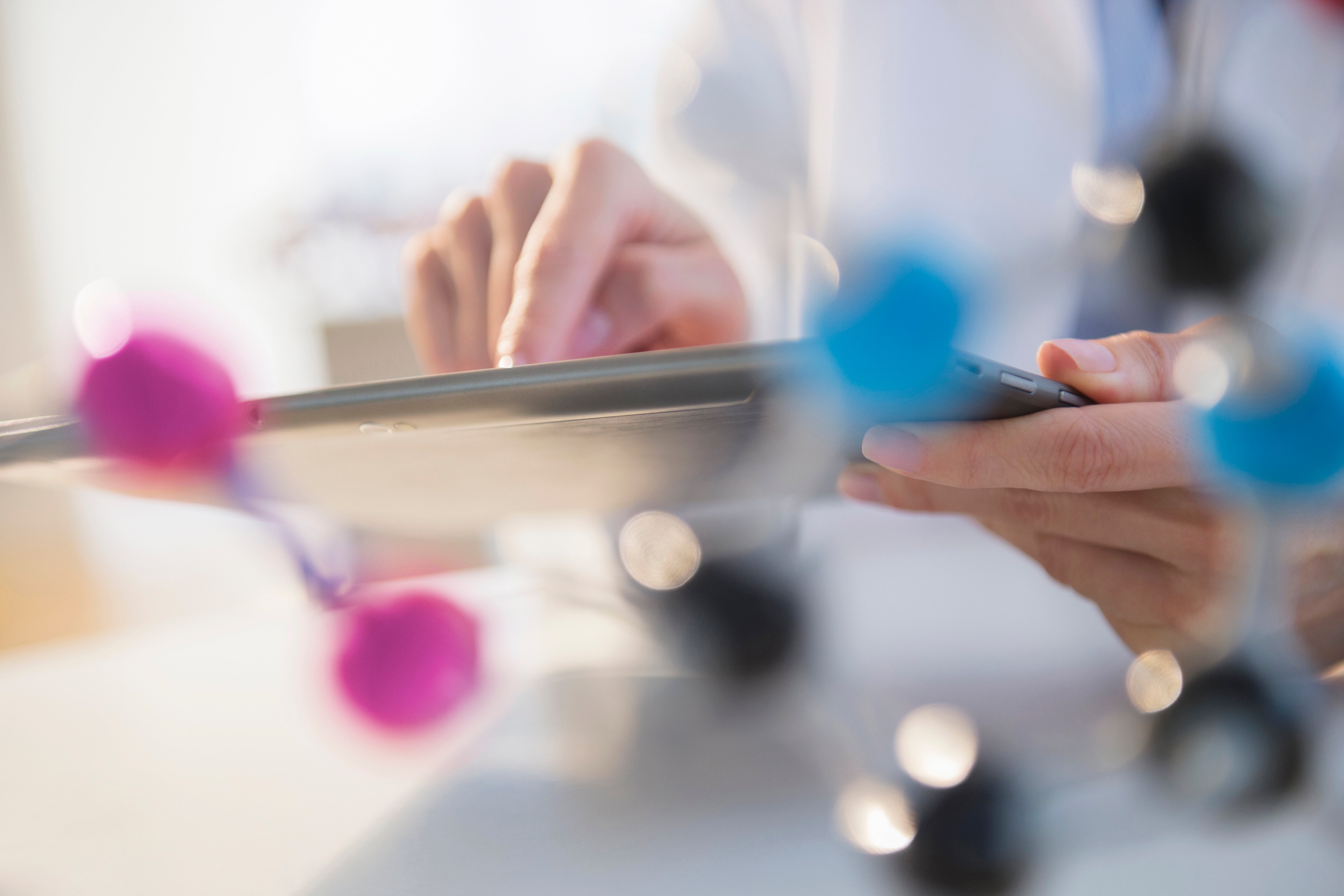 Mixed race scientist using digital tablet in laboratory